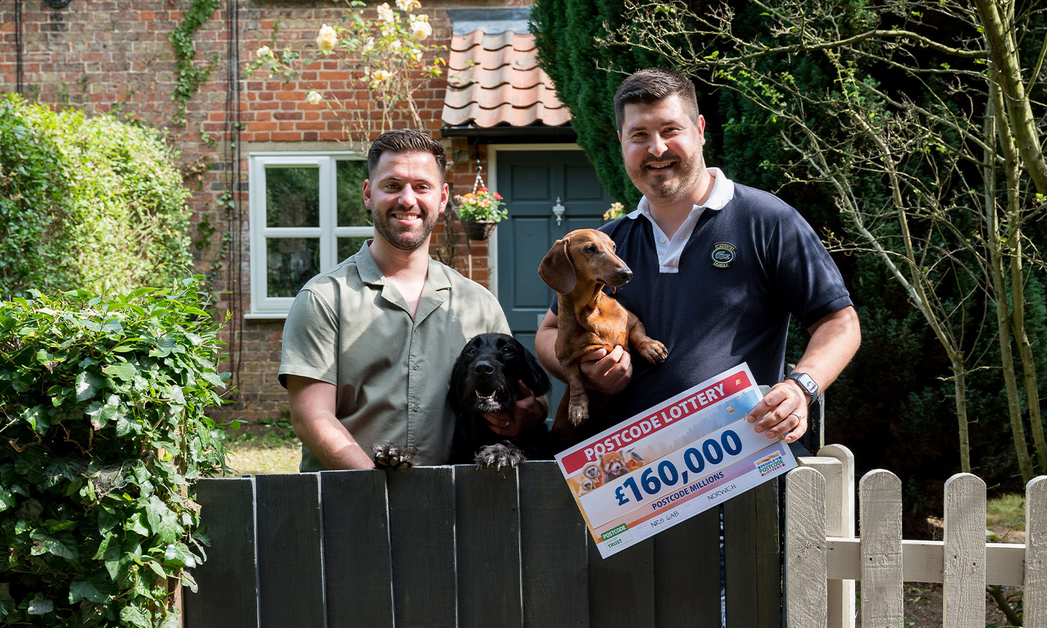 BARKING GLAD: Couple celebrate with dogs Harry and Bertie