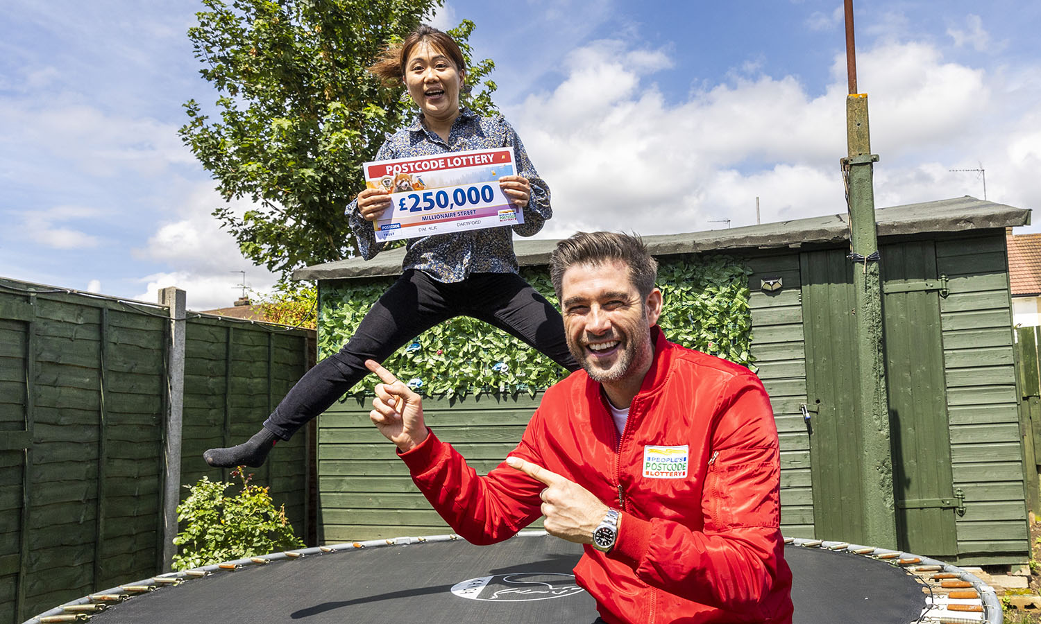 BOUNCING CHEQUE: Winner Yu is jumping for joy after picking up a £250,000 prize