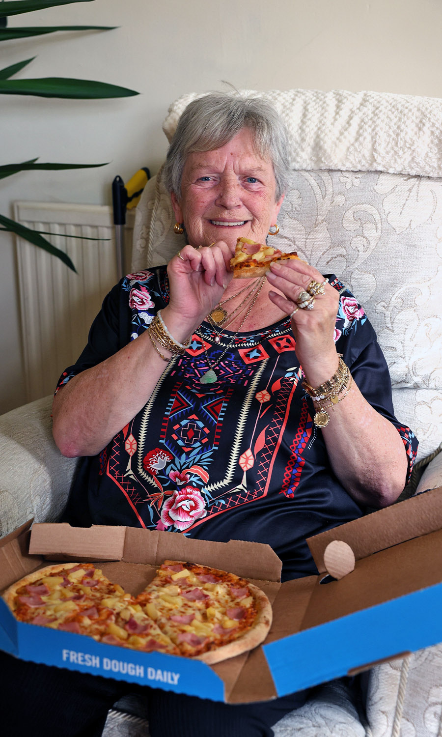 NICE SLICE: Suzanne celebrates by tucking into her favourite ham and pineapple pizza