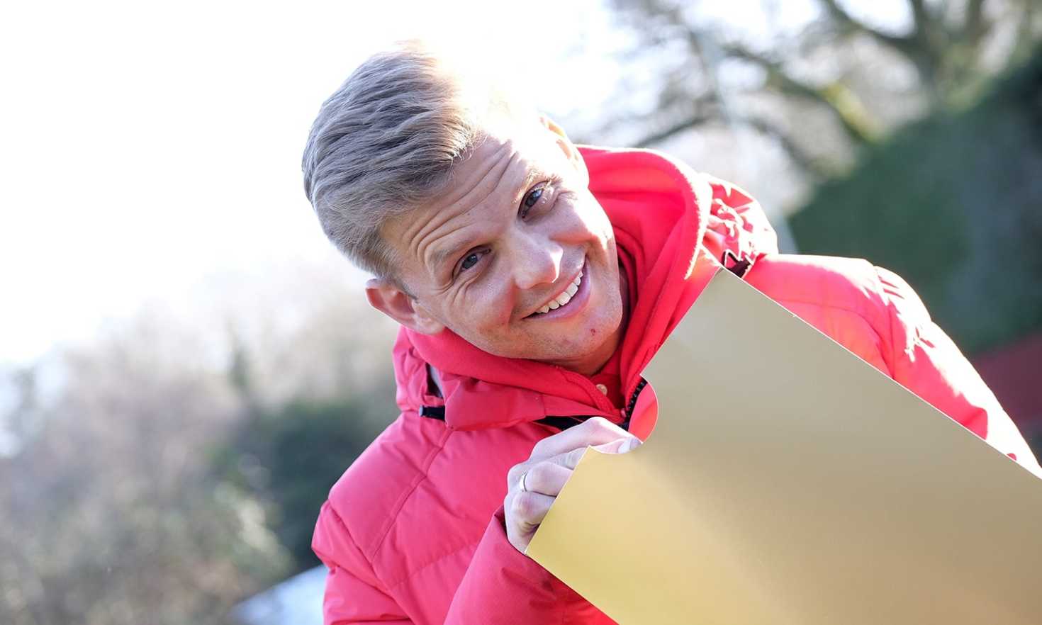 Jeff with a golden envelope and a whopping Street Prize cheque