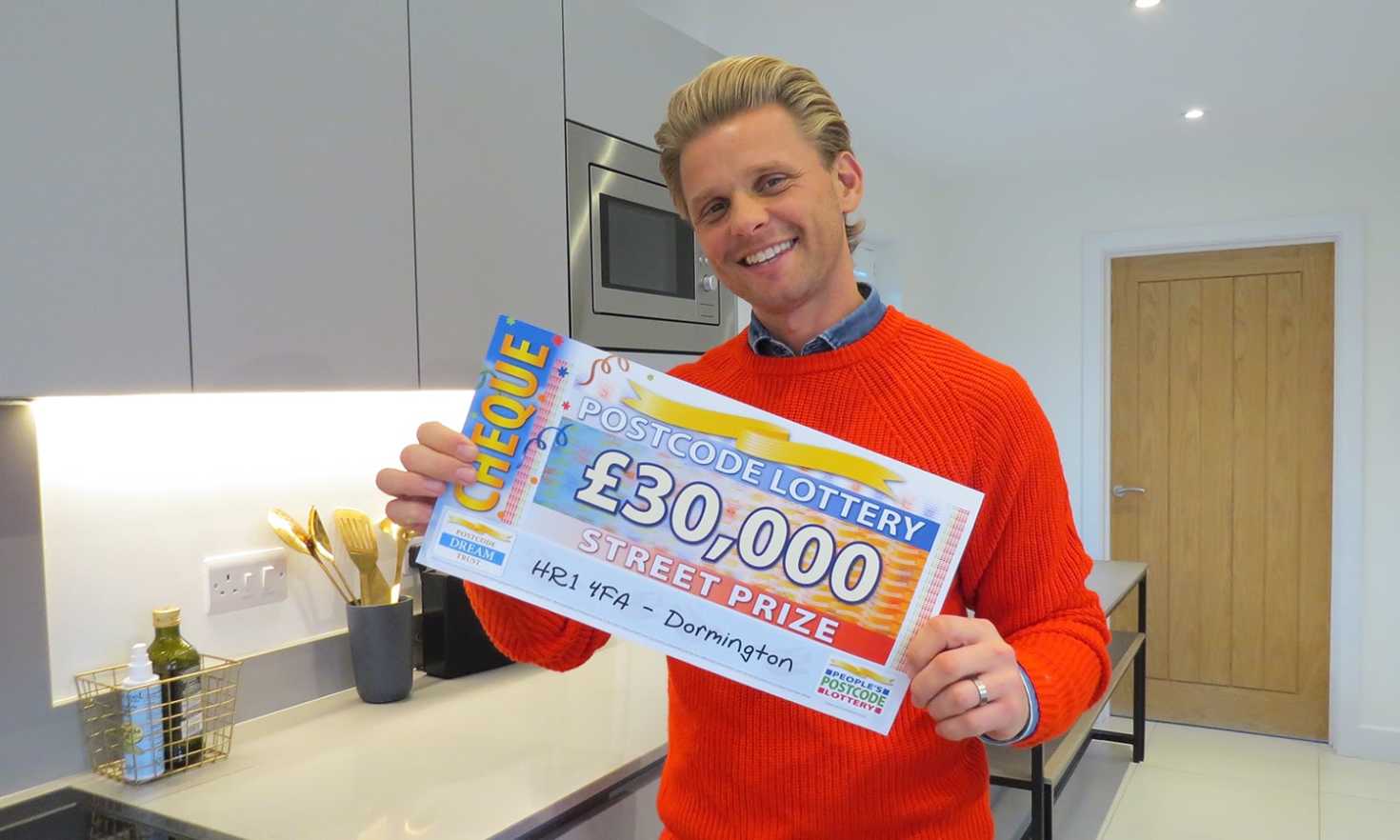 Jeff has a fabulous £30,000 cheque for each of our winners in Dormington