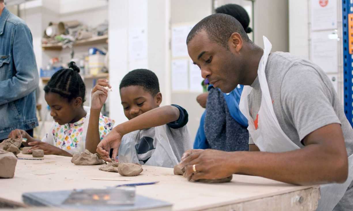 A father and his two children take part in a pottery class at Midlands Arts Centre