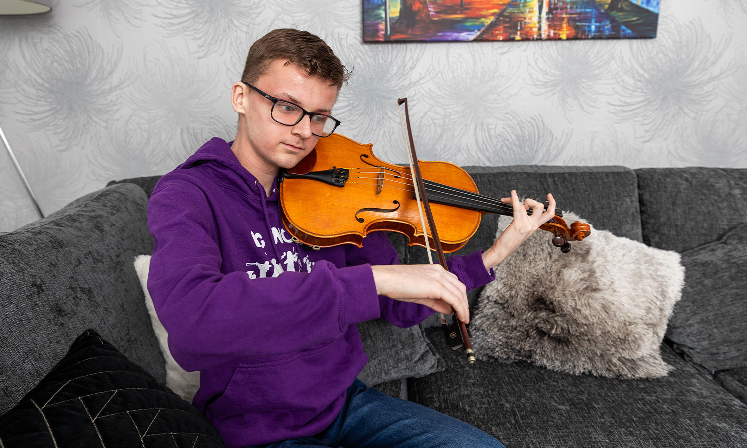 Aiden practicing his viola technique at home