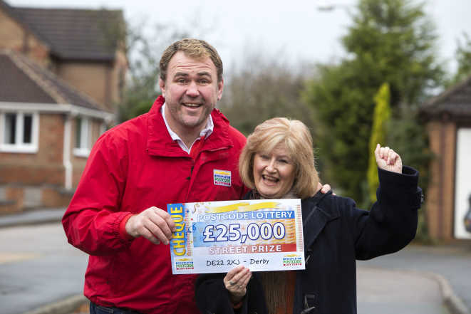 Wendy Beric from Derby cheers her win with Scott Quinnell