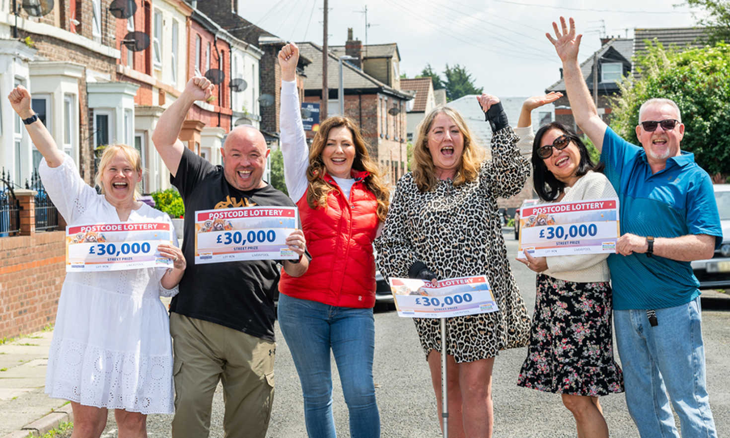 Our Winning Liverpool neighbours celebrate their £30,000 wins together