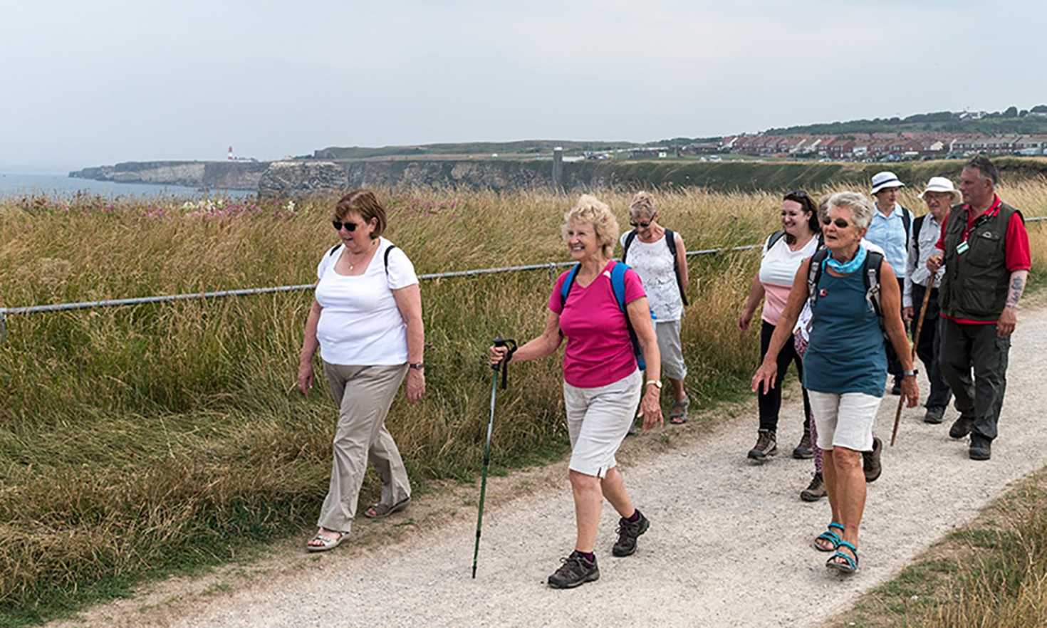 Participants of The Ramblers South Bents to Amble stretch opening event with volunteer Nuala