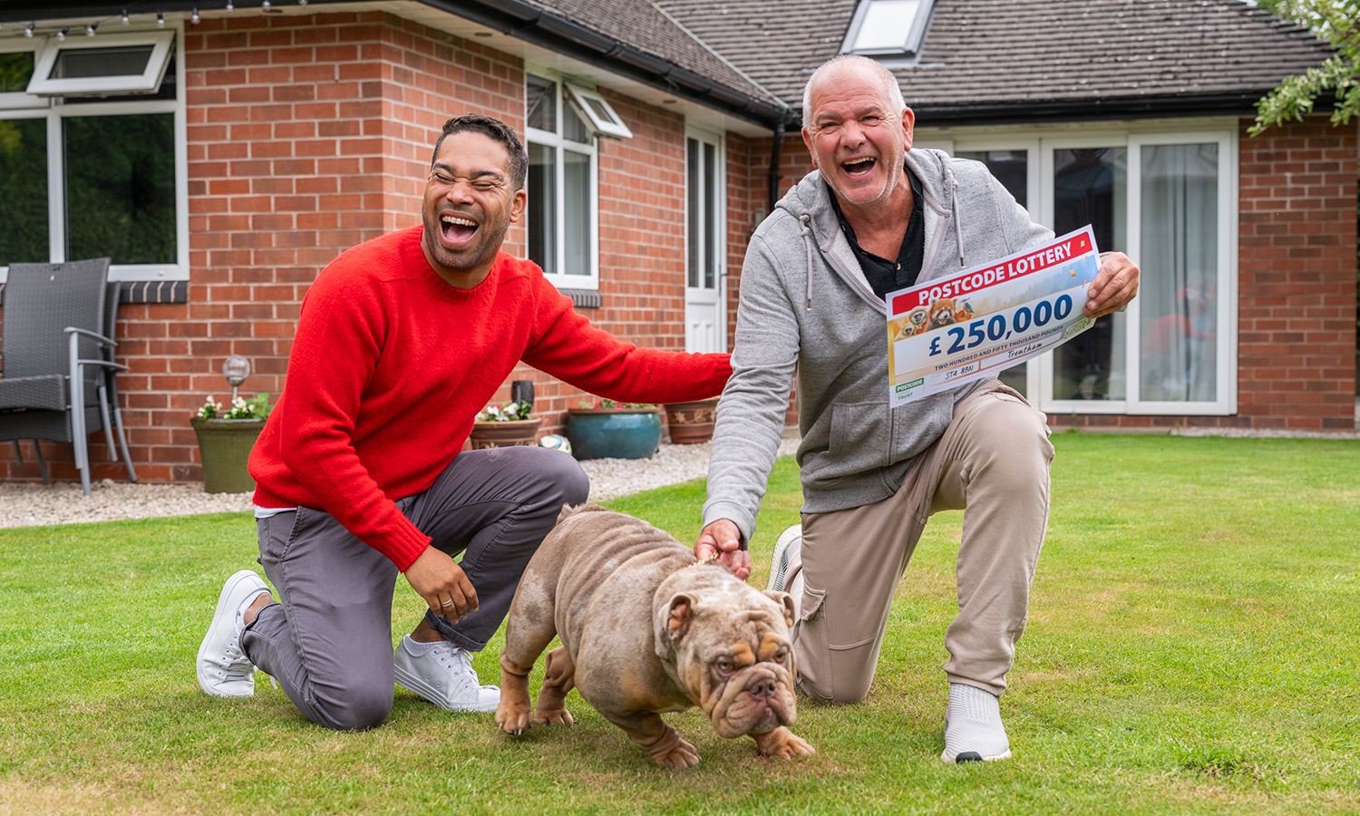 Tim, pet English Bulldog Donald and Danyl Johnson