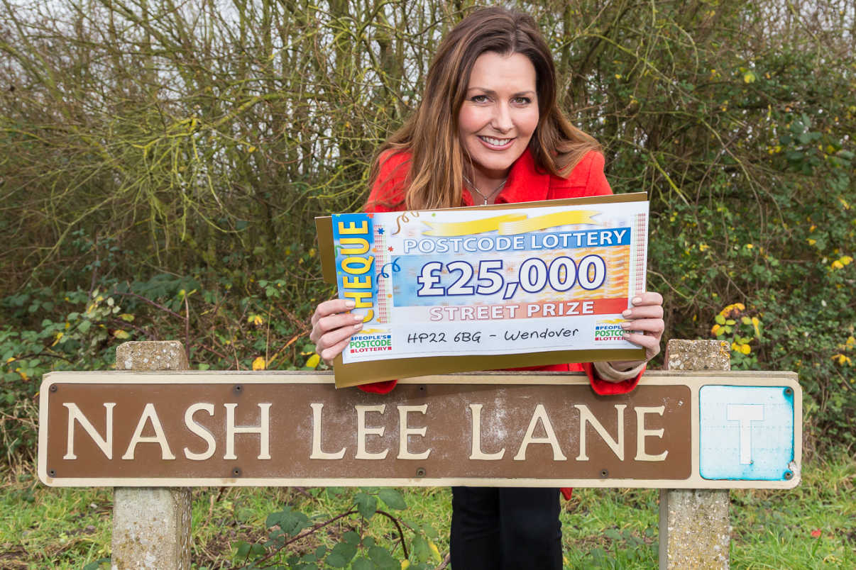 People's Postcode Lottery presenter Judie McCourt with a lovely £25,000 cheque for one lucky winner