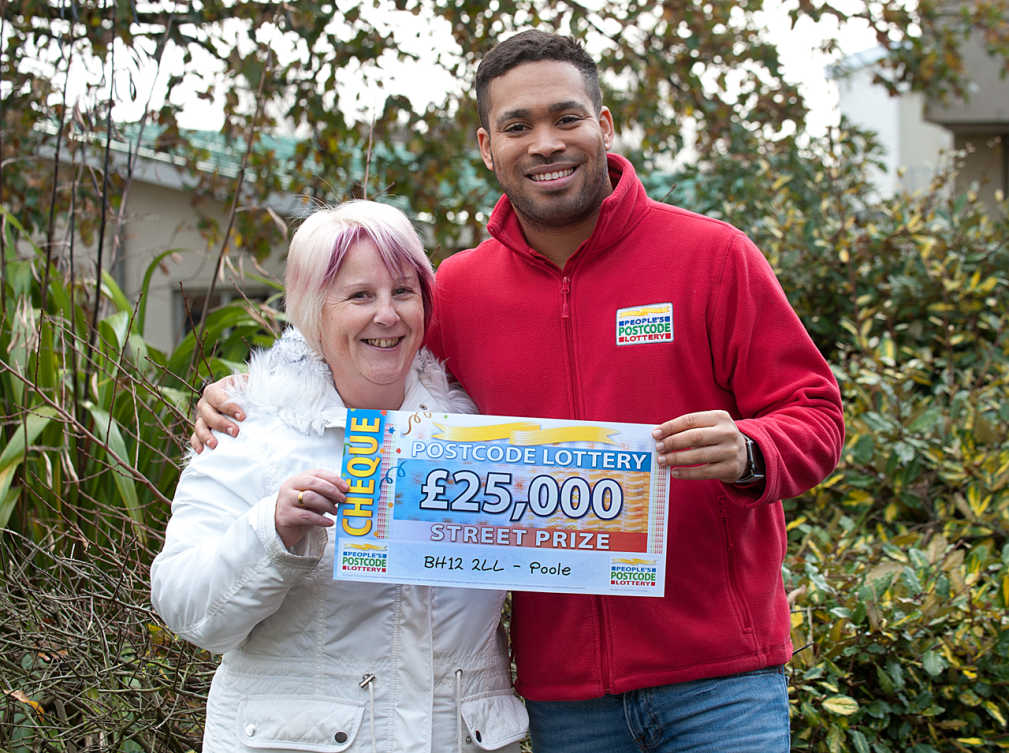 People's Postcode Lottery ambassador Danyl Johnson with £25,000 Street Prize winner Sandra