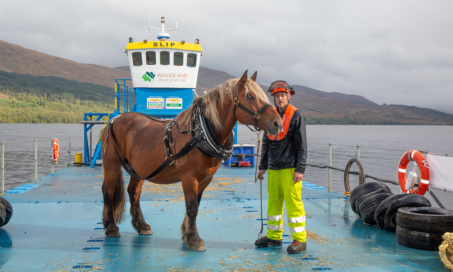 Tarzan and his handler Simon Dakin commuting to work aboard the barge Each-Uisge