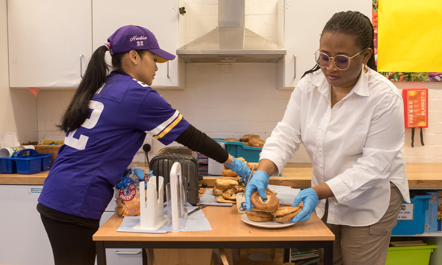 Katarina (left) and Lola prepare boxes of breakfast bagels daily