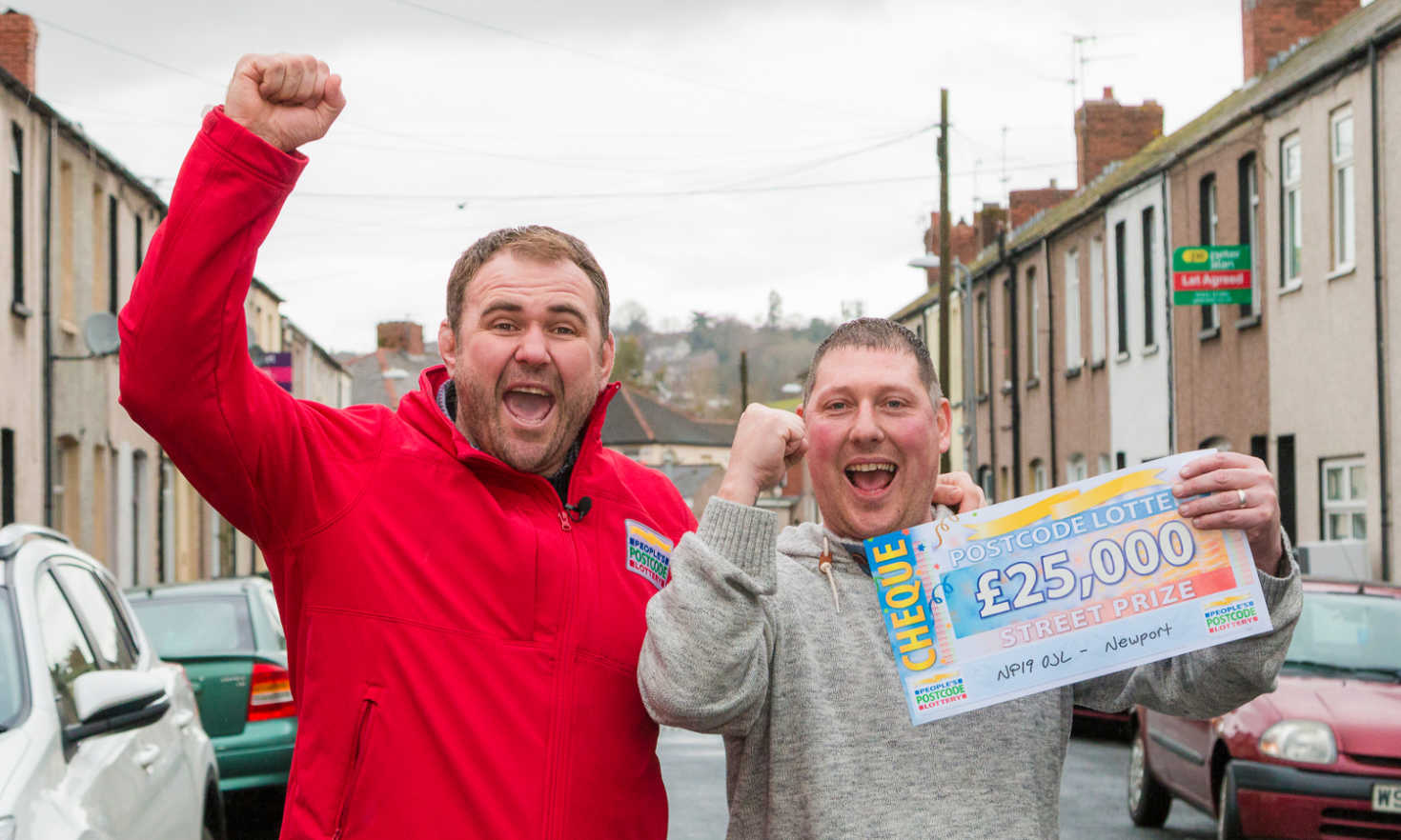 People's Postcode Lottery presenter Scott Quinnell and lucky Newport winner Carl Morgan