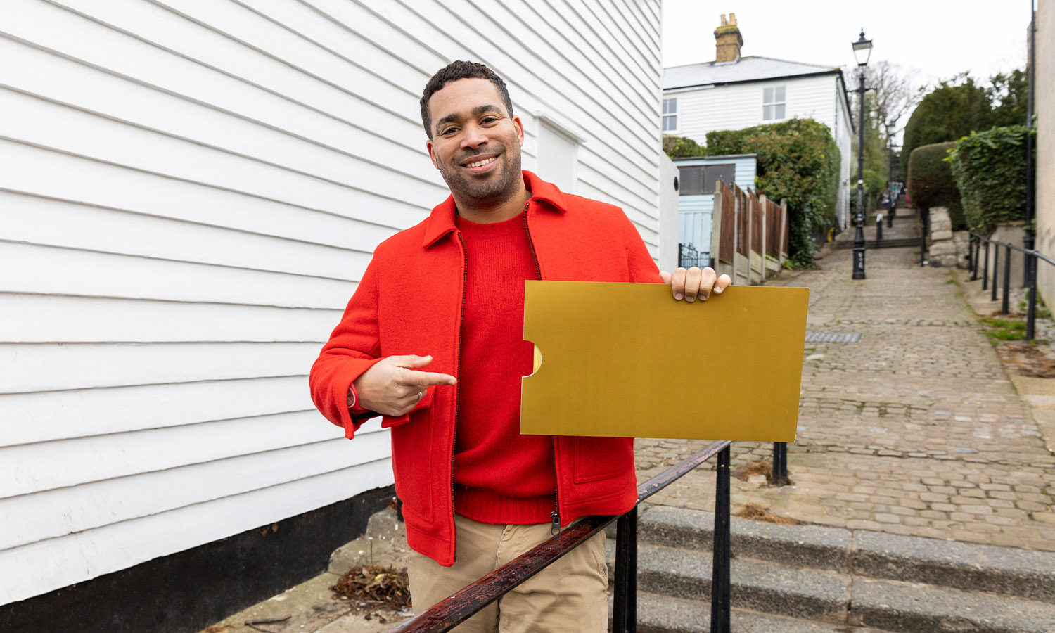 GOLDEN SATURDAY: Postcode Lottery's Danyl Johnson with one of seven winning envelopes