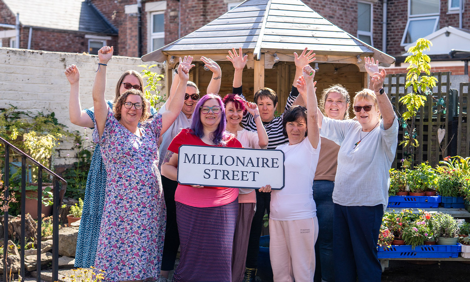 HAPPY PLACE: Charity team welcome Millionaire Street funding