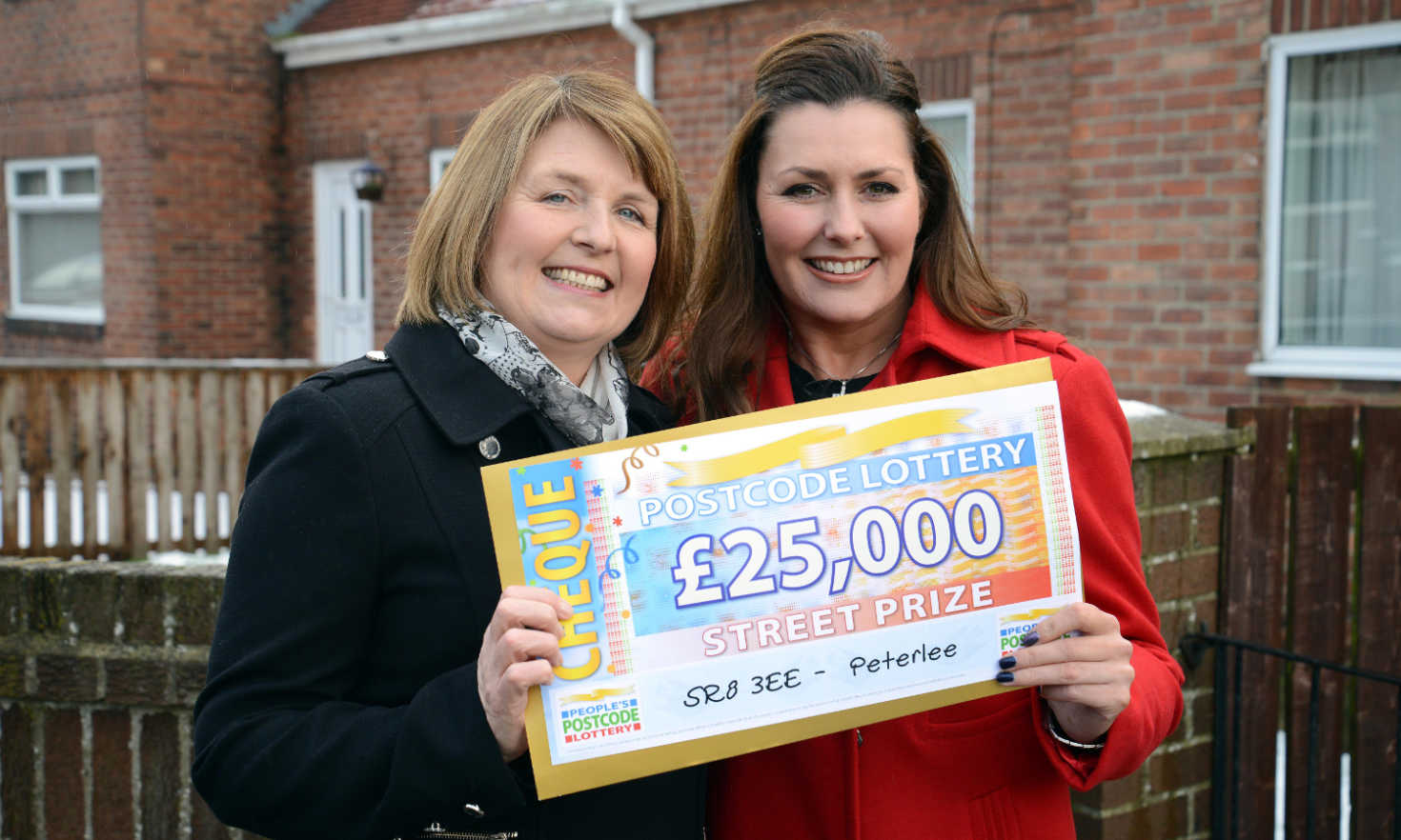 Lucky £25,000 winner Carolyn Booth alongside People's Postcode Lottery presenter Judie McCourt