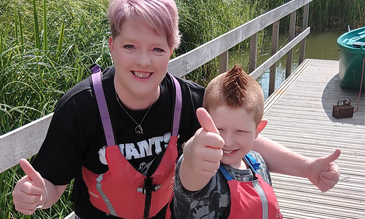 Thumbs up - Christine and Isaac having fun on holiday