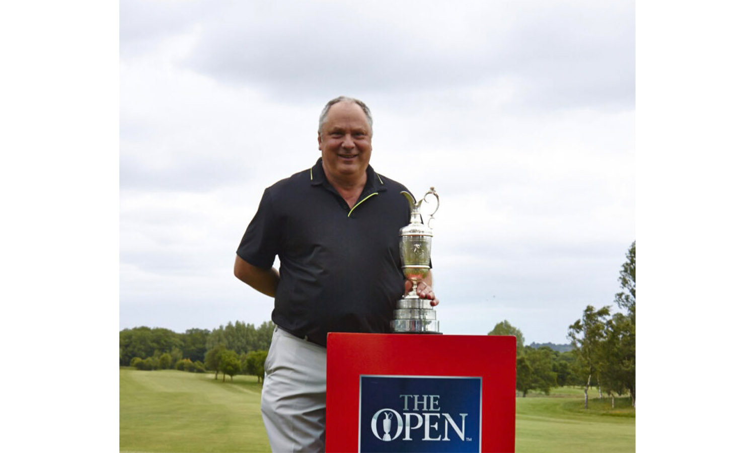 ACE FOR ERNIE: Giddy golf pro Ernie poses with the Claret Jug