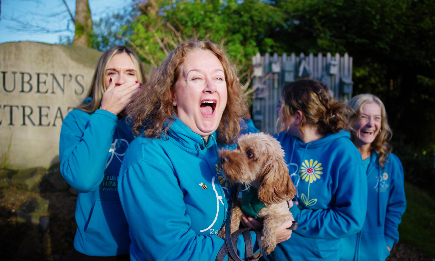 REUBEN'S TREAT: Nicola with therapy-dog-in-training Dolly and staff