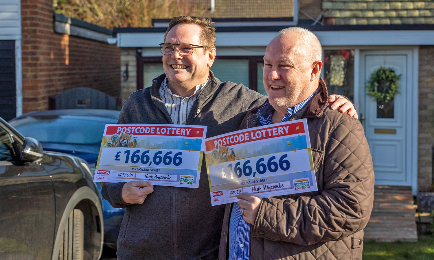 GOLD PALS ACT: Neighbours Bob (left) and David celebrate together