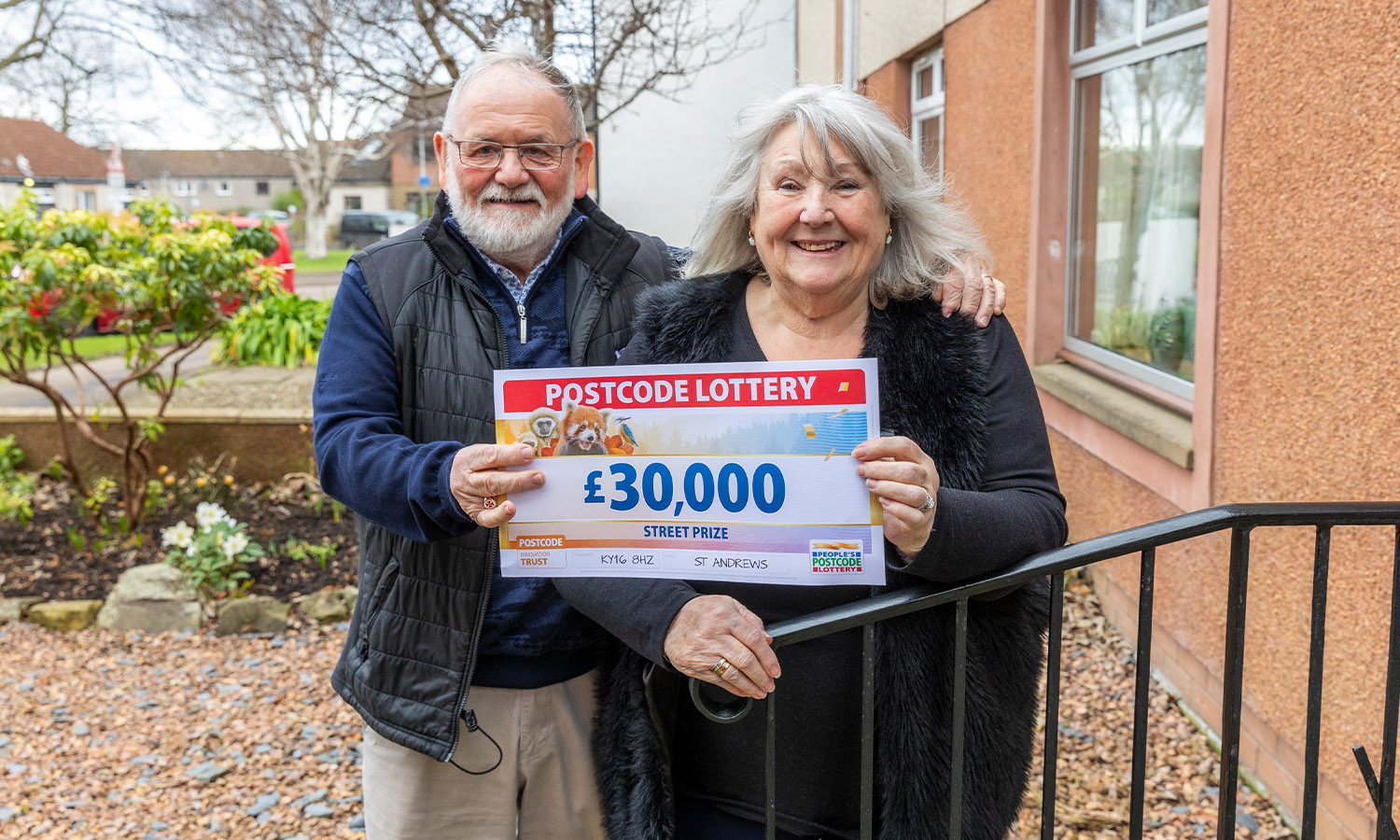 TO HAVE AND TO HOLD: Frances and John clutch her winnings