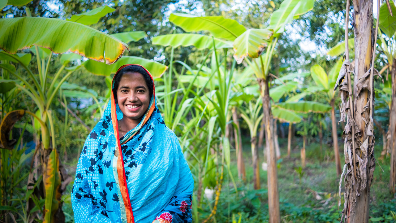 Shukla smiles in her garden in Bangladesh