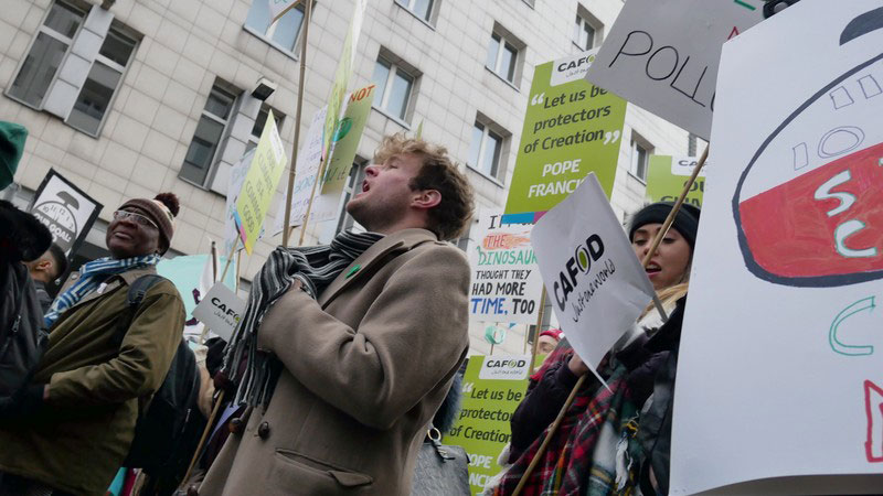 Europe - Poland - CAFOD campaigner leads chant at COP24 rally