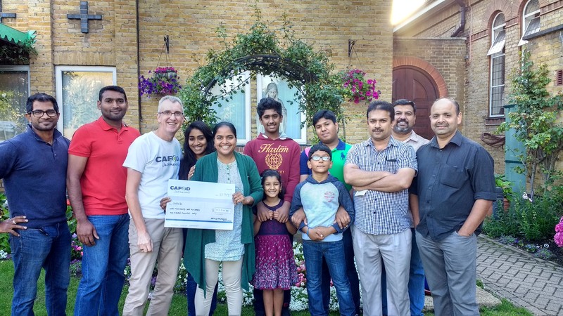 Enfield Malayalee Present Cheque for _1111 to CAFOD representative Tony Sheen