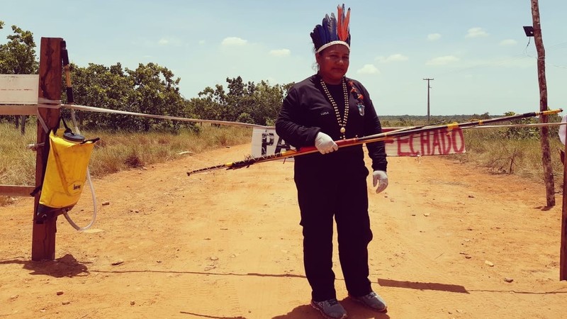 Coronavirus - Amazon, Brazil - Indigenous woman standing guard