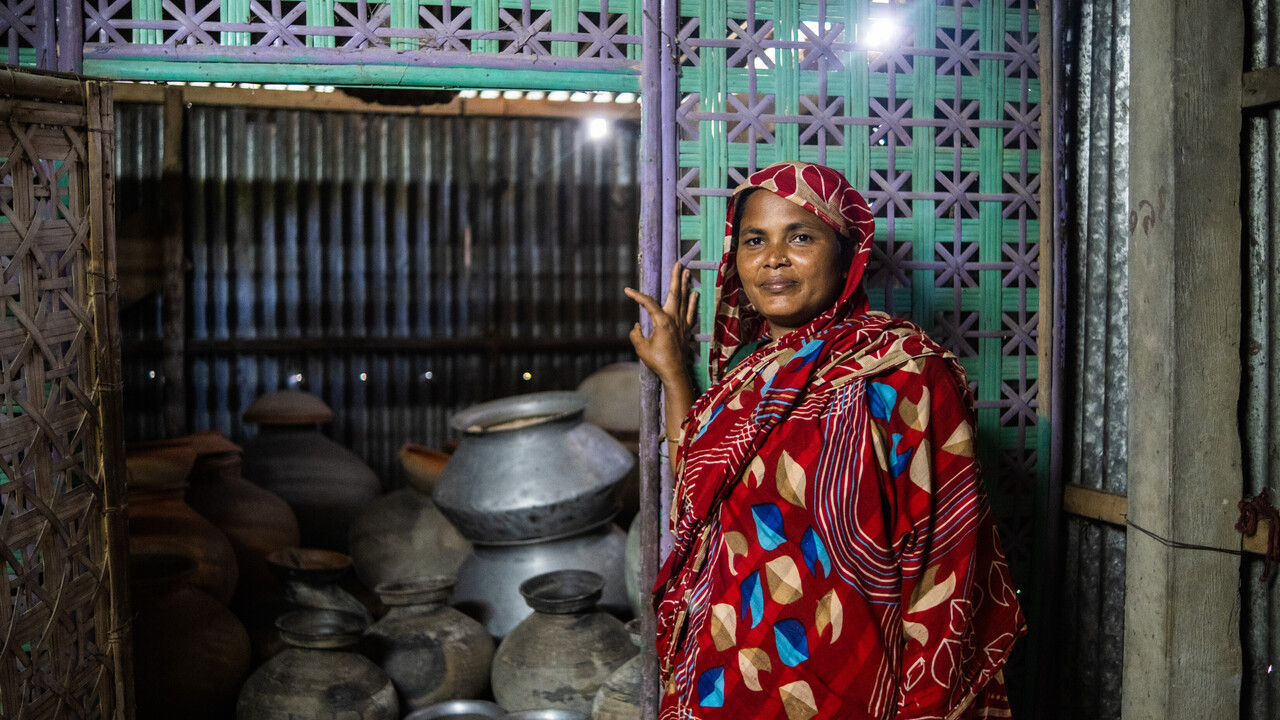 Salina standing next to her seed store room