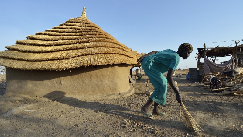 Africa - South Sudan - woman in front of Caritas home