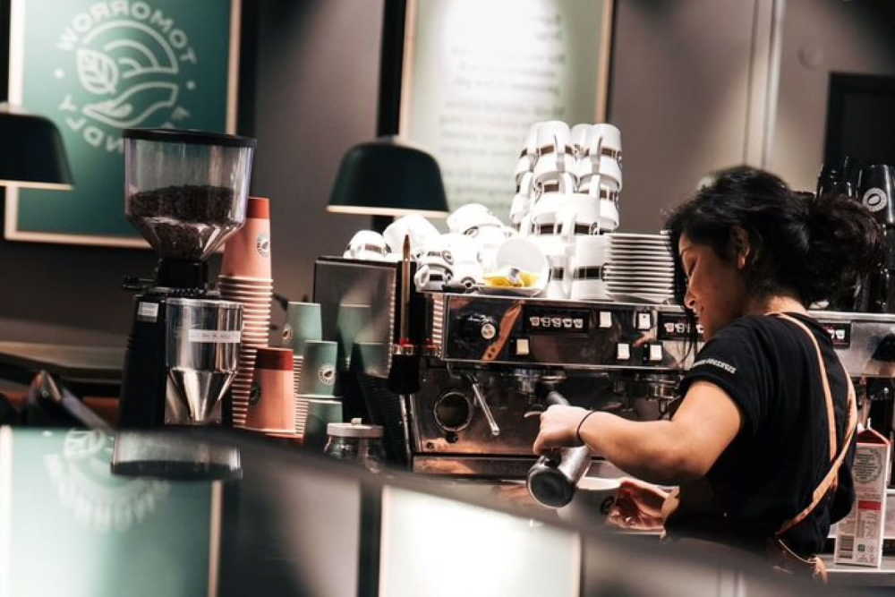 Person serving coffee in Espresso House