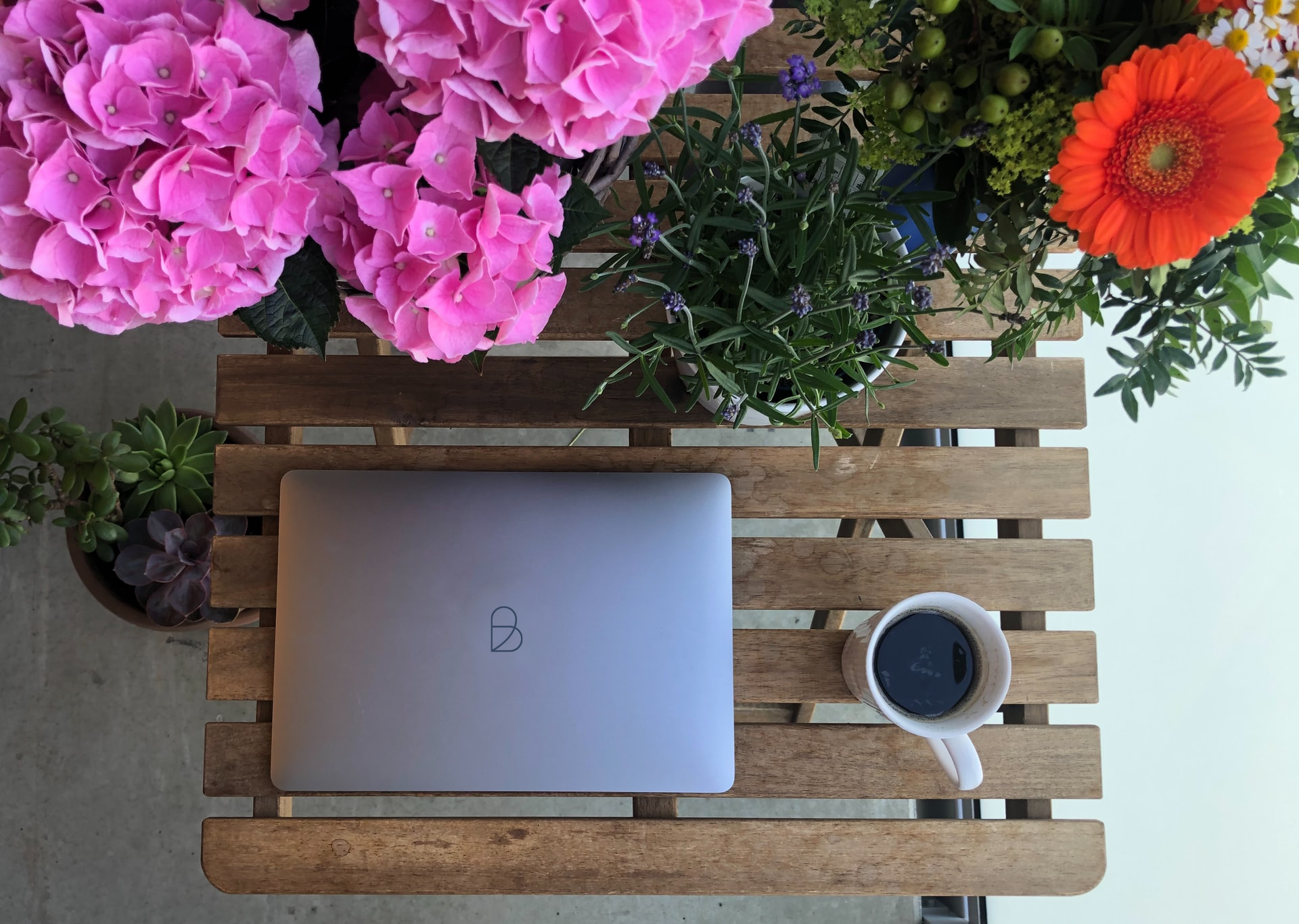laptop-on-table-on-balcony
