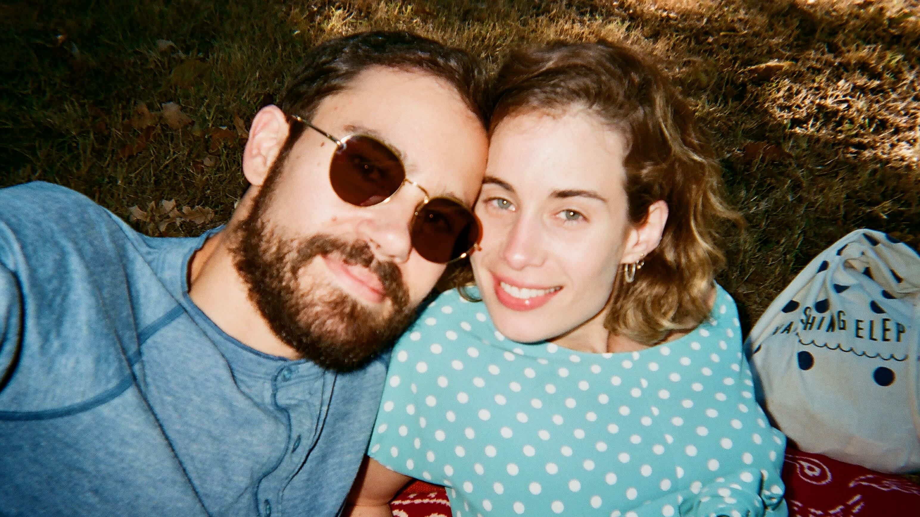 Lyft riders Jared and Anna pictured together on a picnic. 
