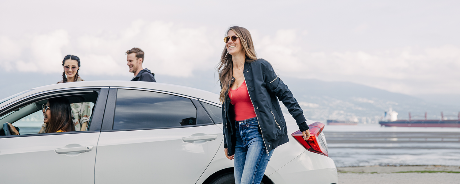 Three Vancouverites getting out of a Lyft near the waterfront. 