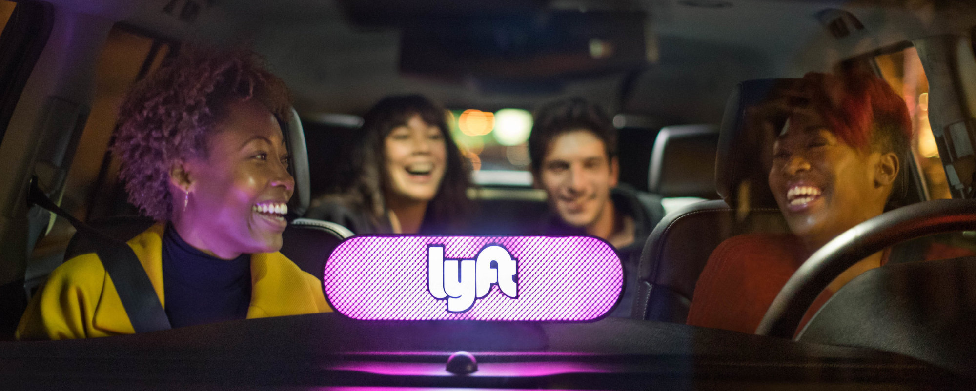 Friends riding home in a Lyft Lux