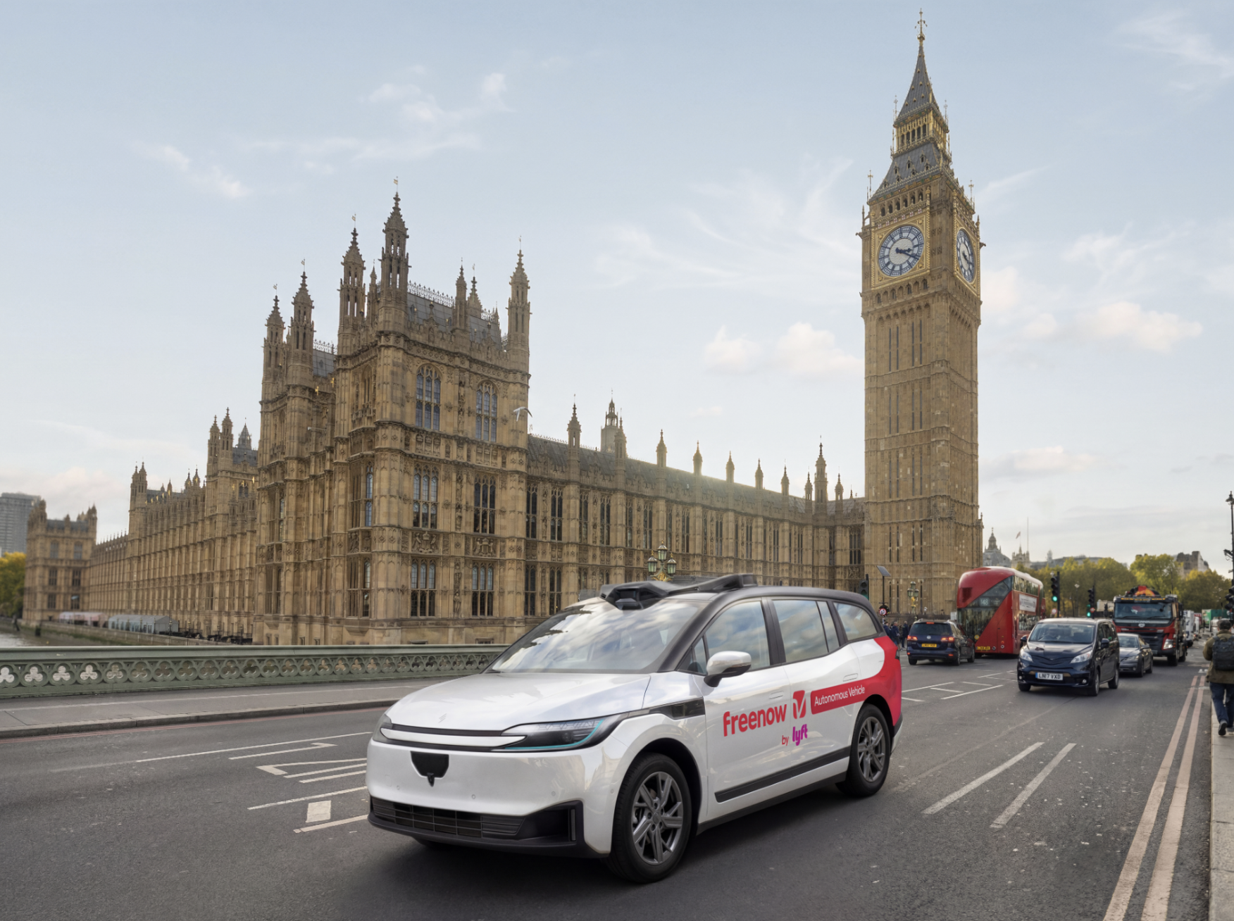 Baidu Apollo Go RT6 robotaxi with Freenow by Lyft branding on a London street