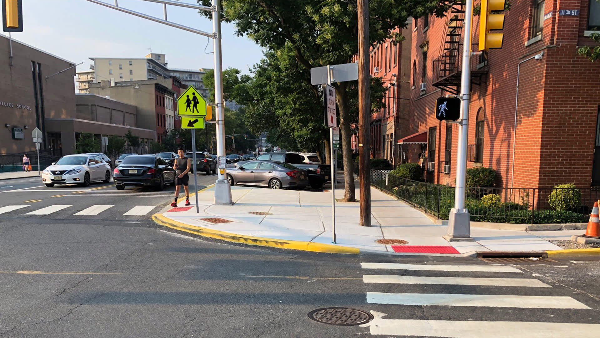 Installation of Vision Zero upgrades at 11th Street and Willow Avenue to increase pedestrian visibility and reduce conflicts between turning vehicles and pedestrians crossing the street.(Image credit: City of Hoboken)