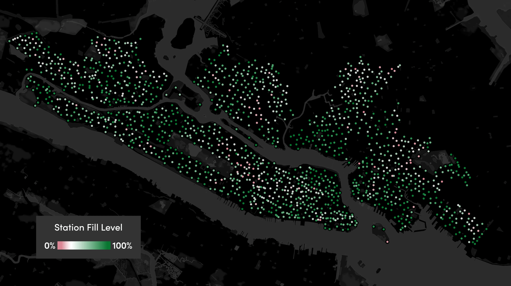 Animated image of Citi Bike station availability in New York City, represented by multicolored dots on a dark background showing the contours of Manhattan, Brooklyn, Queens, and the Bronx.