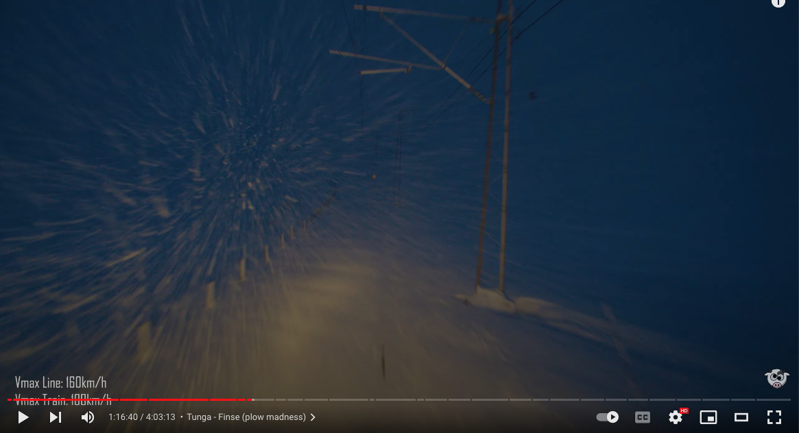 Photograph still of a YouTube video of railway tracks nearly obscured by dark and snow in Norway.