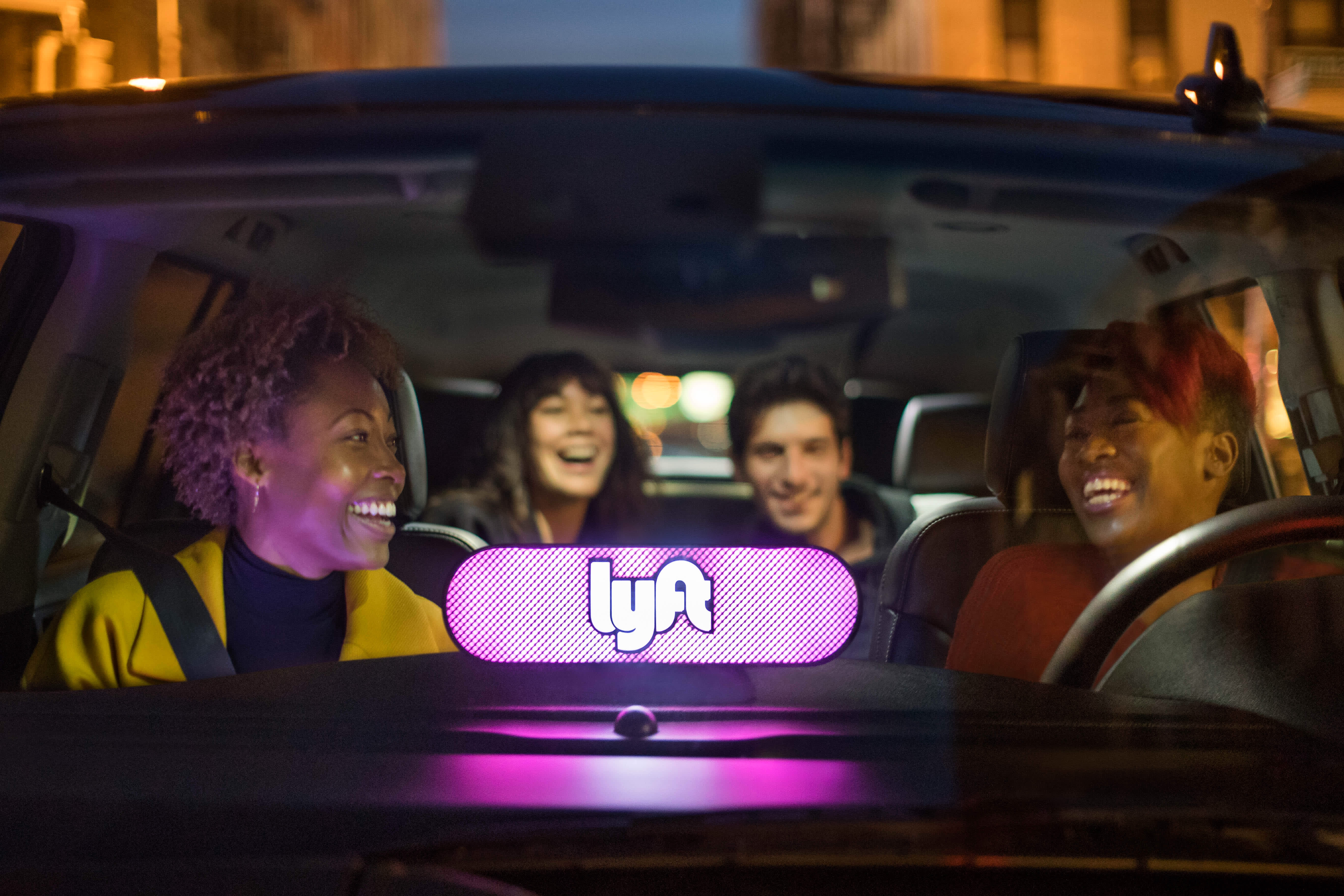 image of passengers and driver in a Lyft car