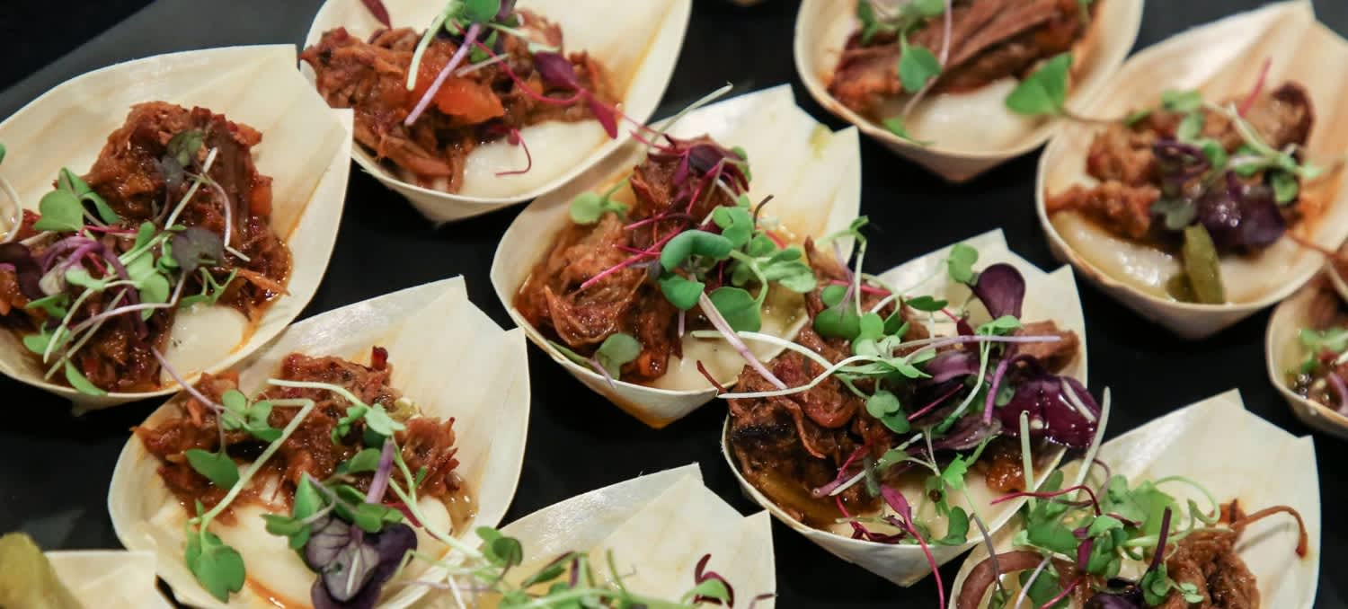 An image of tacos with toppings.