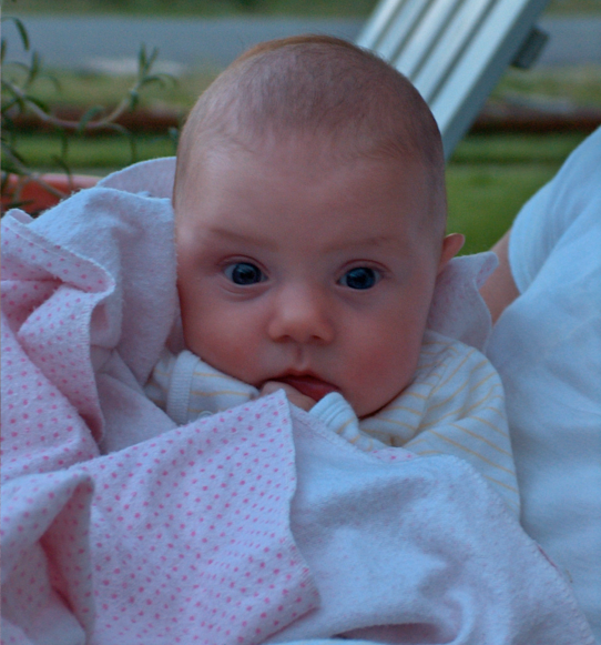 Child living with Rett syndrome at 6-18 months wrapped in blankets
