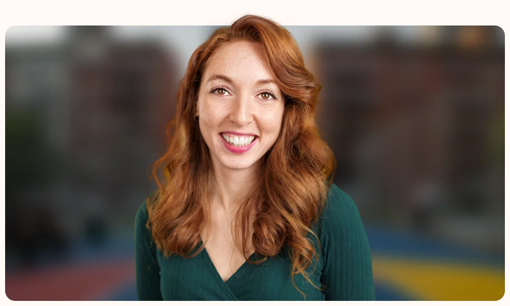 Portrait of a professional on a softly blurred city street, illustrating the TestGorilla article "What is talent sourcing?"