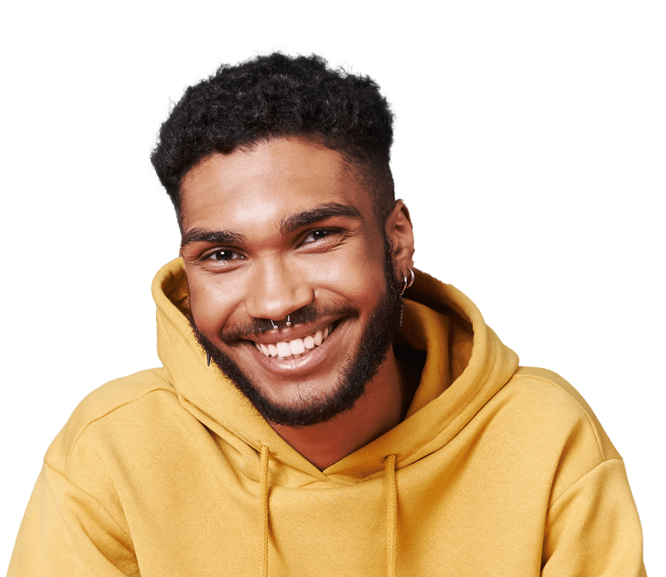 A happy young man with facial piercings