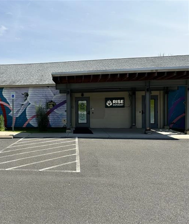 Massachusetts Dispensaries Recreational - RISE Amherst Exterior Desk.webp