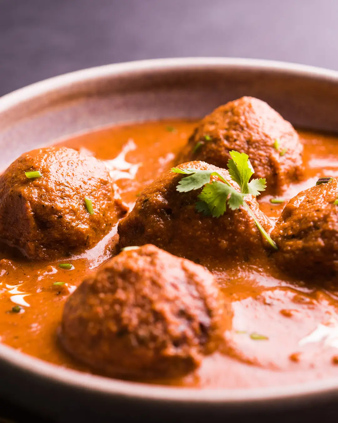 lamb-meatballs-in-red-sauce.webp