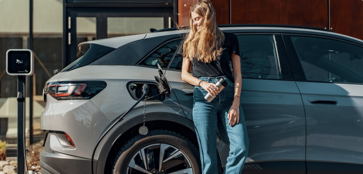 Girl posing with EV SUV