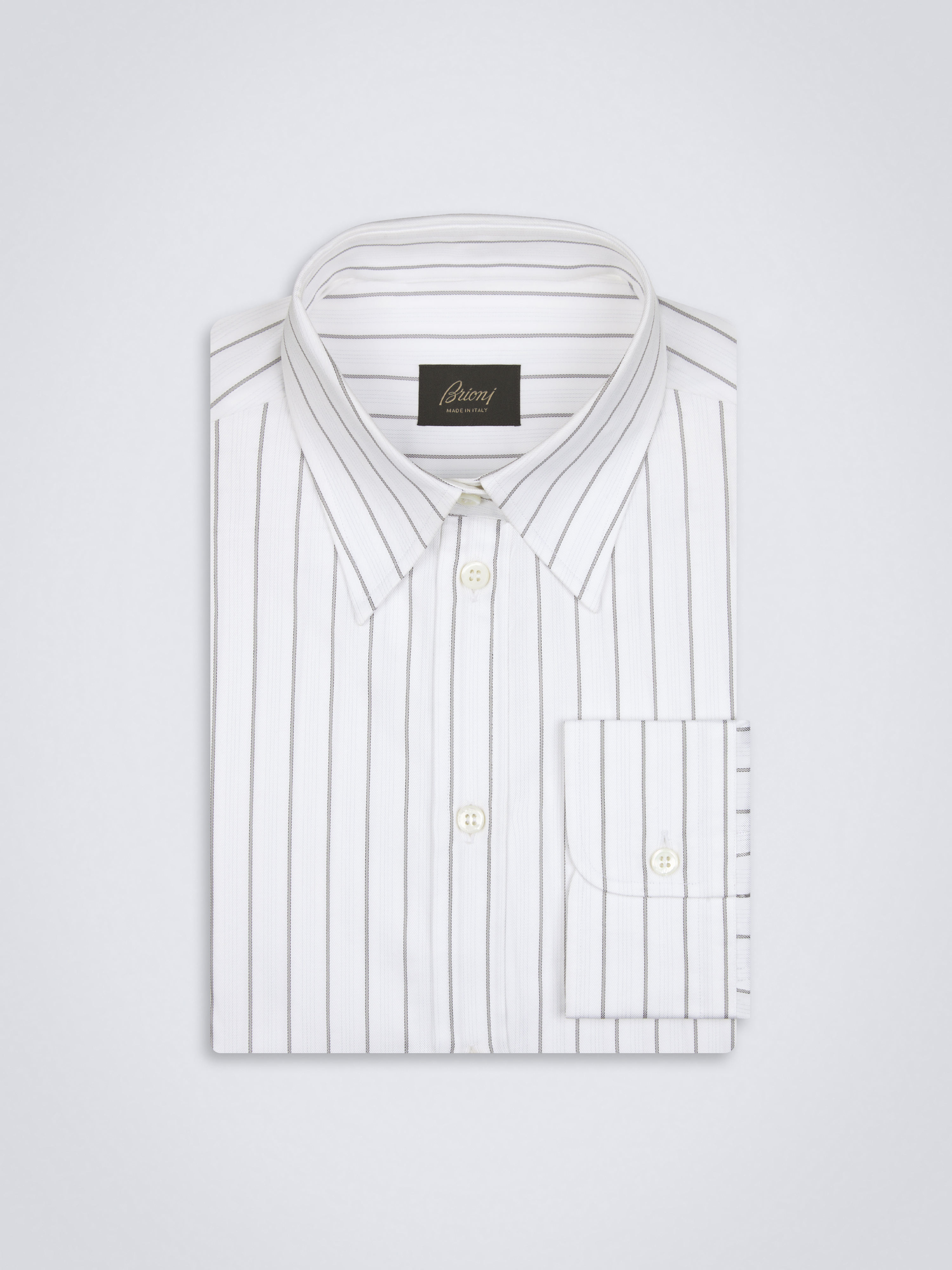 white dress shirt with black stripes Tarinah Front-Split Striped / Navy / L Modern Silhouette Striped Print For A Classic Look Spread Collar Long Sleeve 95% Polyester / 5% Spandex Imported Model Measurements SUITSUPPLY Off-white Striped Lyocell Shirt