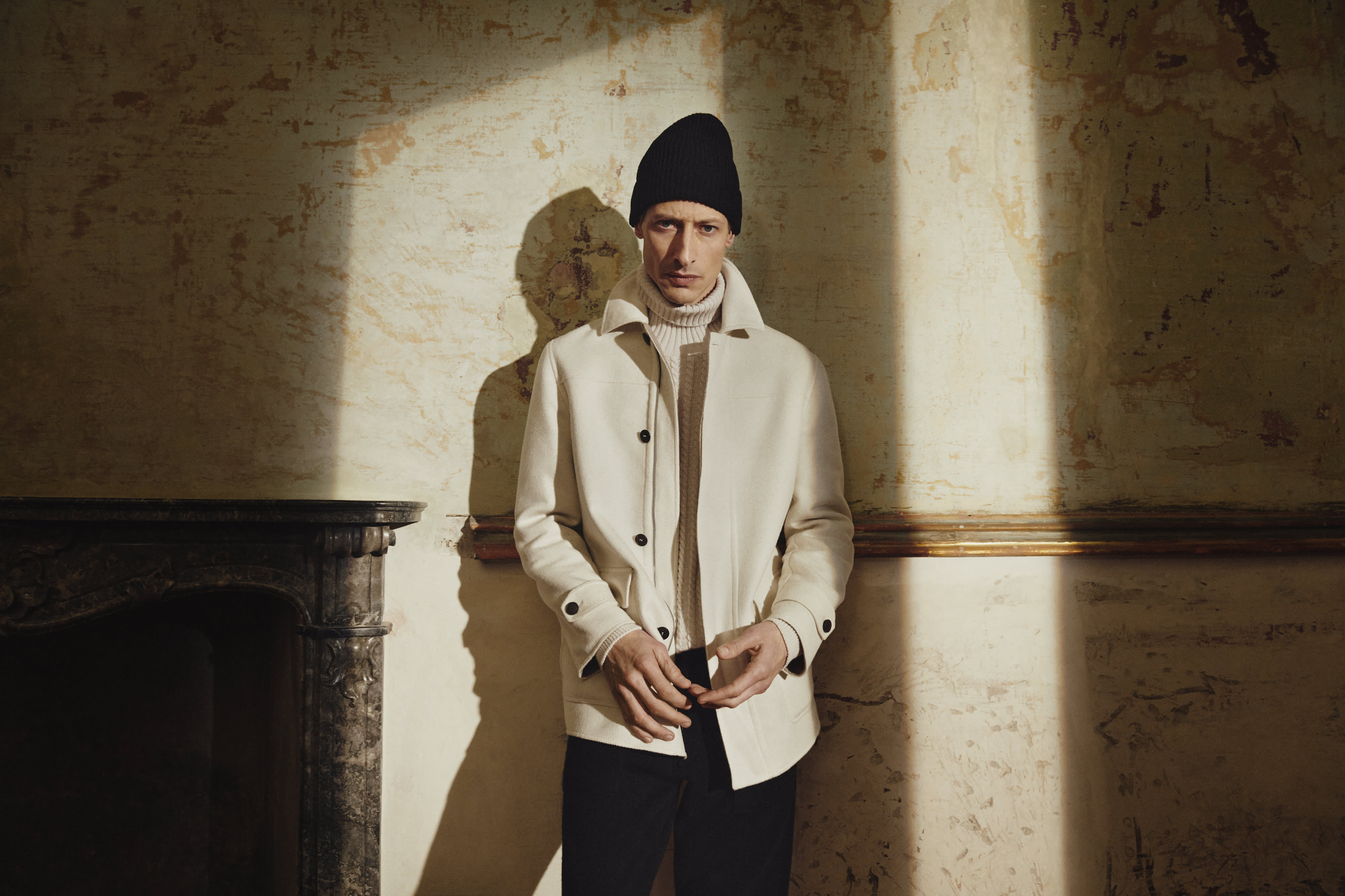 Brioni model wearing white outerwear from fall winter 22