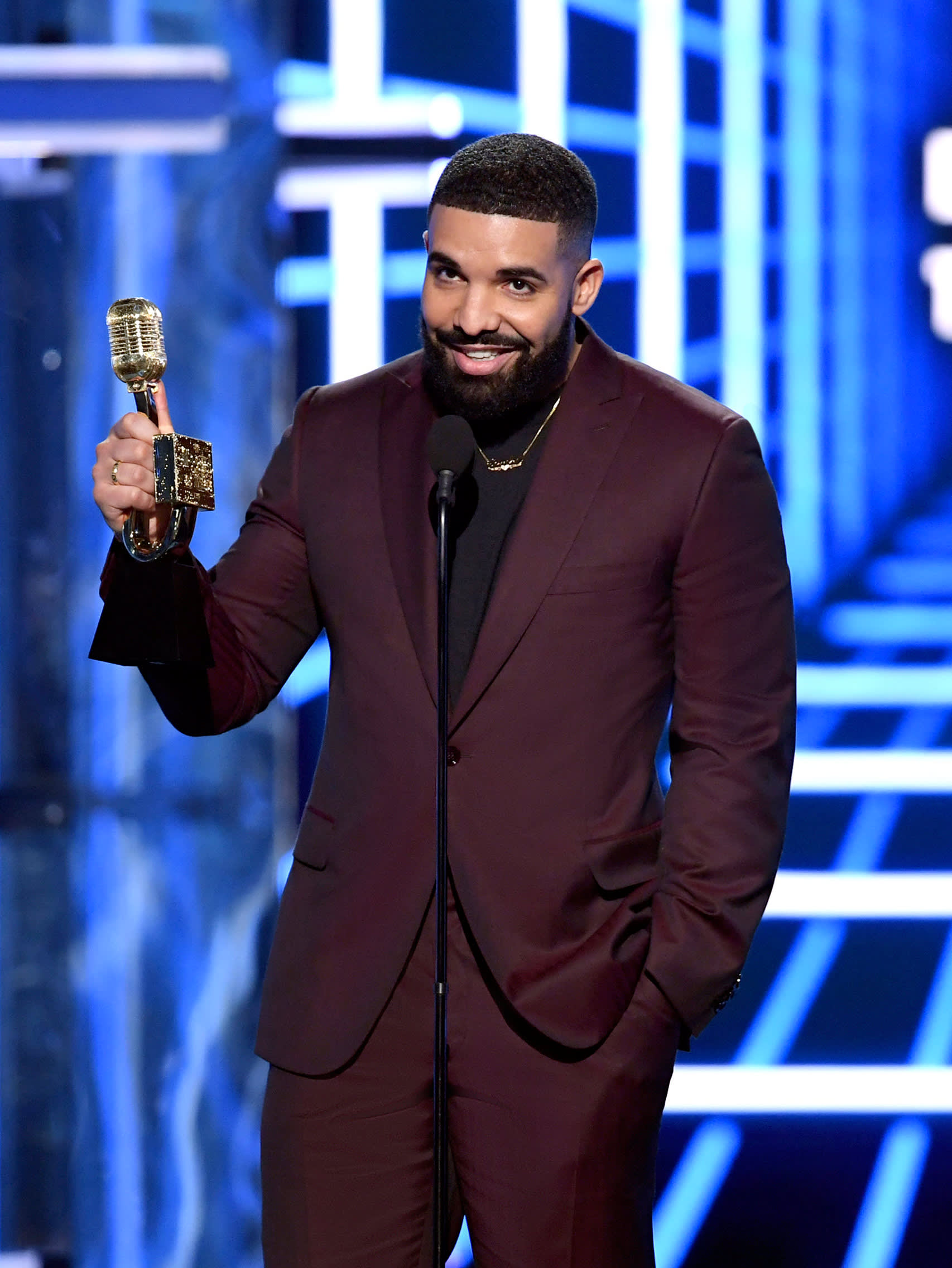 Drake wearing a Brioni bespoke burgundy suit